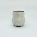 Ceramic cup with a chicken design on a white background