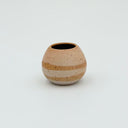 Kleybird Strata mini vase with striped clay bands and pale aqua interior.