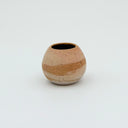 Kleybird Strata mini vase with striped clay bands and pale aqua interior.