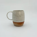 Kleybird Strata mug showing marbled clay bottom and white speckled glaze top.