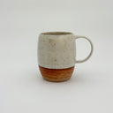 Kleybird Strata mug showing marbled clay bottom and white speckled glaze top.