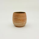 Kleybird Strata handleless tumbler with marbled clay exterior and light aqua interior.