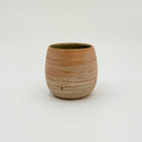 Kleybird Strata handleless tumbler with marbled clay exterior and light aqua interior.