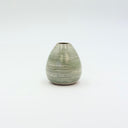 Small sage green ceramic bud vase with smooth horizontal striped glaze, held in a hand for scale.