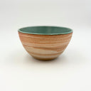 Strata collection medium ceramic bowl with marbled unglazed exterior and turquoise blue glazed interior, hand-thrown in Boulder CO.