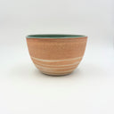 Strata collection weighted stoneware bowl with marbled unglazed exterior and smooth turquoise green glazed interior, hand-thrown in Boulder CO.