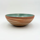 Strata collection medium low ceramic bowl with marbled unglazed exterior and turquoise blue glazed interior, hand-thrown in Boulder CO.